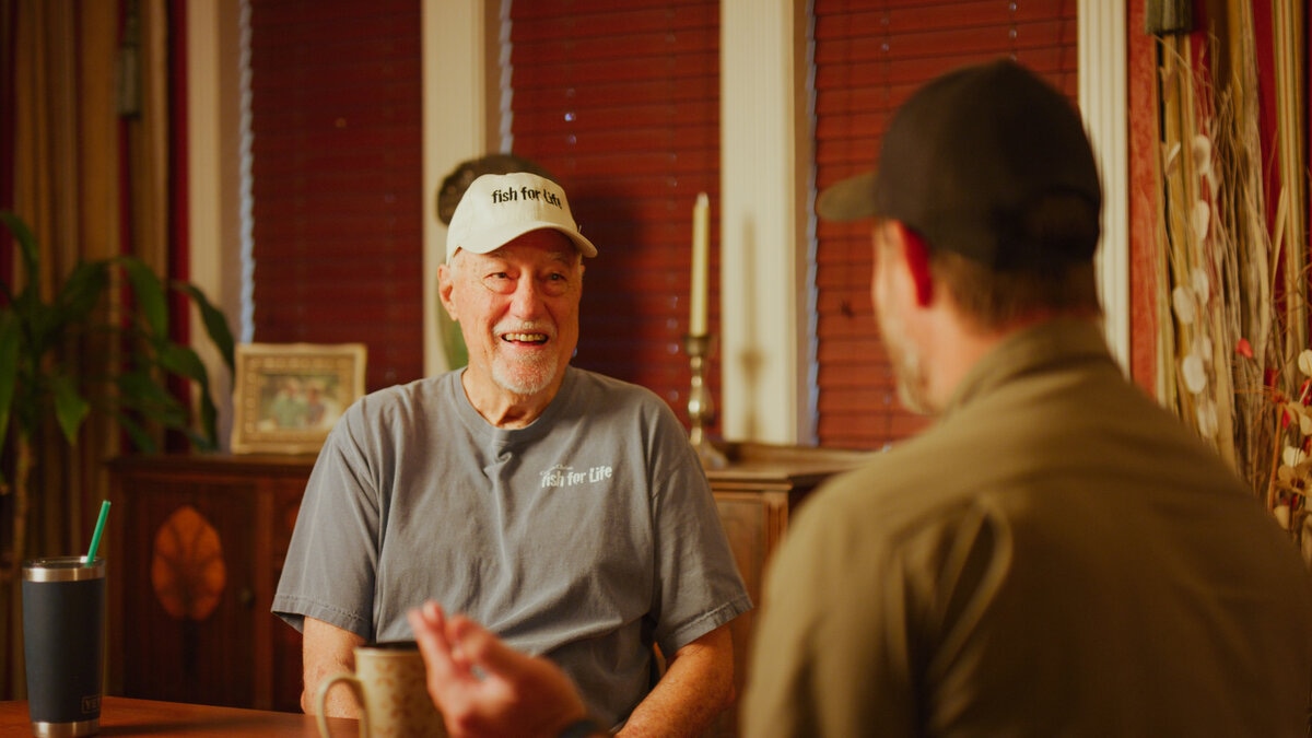 Photo of Robbie Kroger and Chuck Goodwin talking about meat benefits of hunting and fishing in South Texas